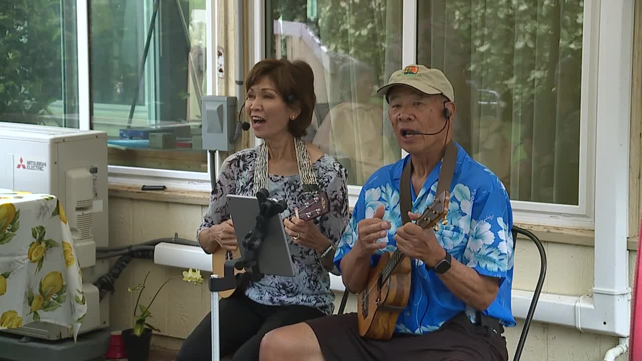 Sandy (left) and Gordon Young (right) during a performance at a care home.