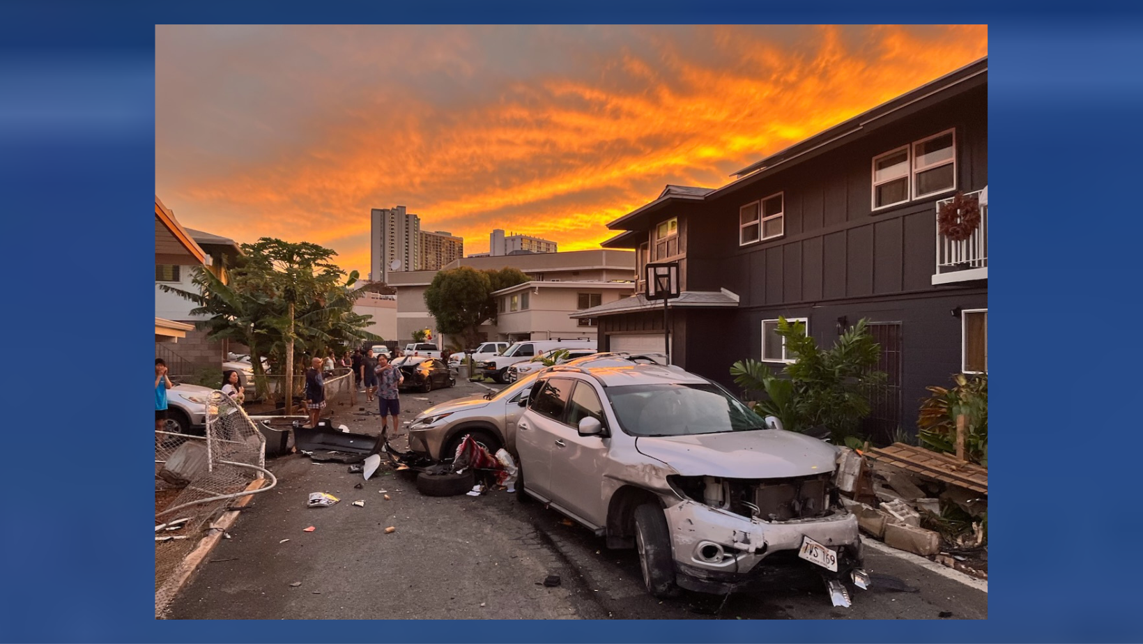 Debris and wrecked vehicles lay on the street after a car hits several homes on Saturday, June 3, 2023 in Honolulu, Hawaiʻi.
